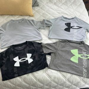 Lot of (4) size large Under Armour shirts in good condition.